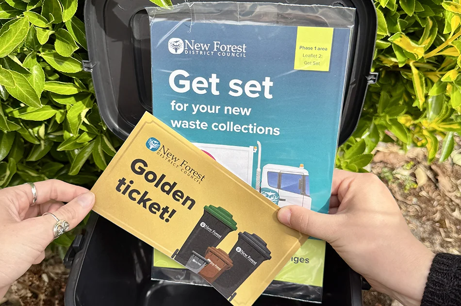 Golden ticket and get set leaflet inside grey indoor food waste caddy